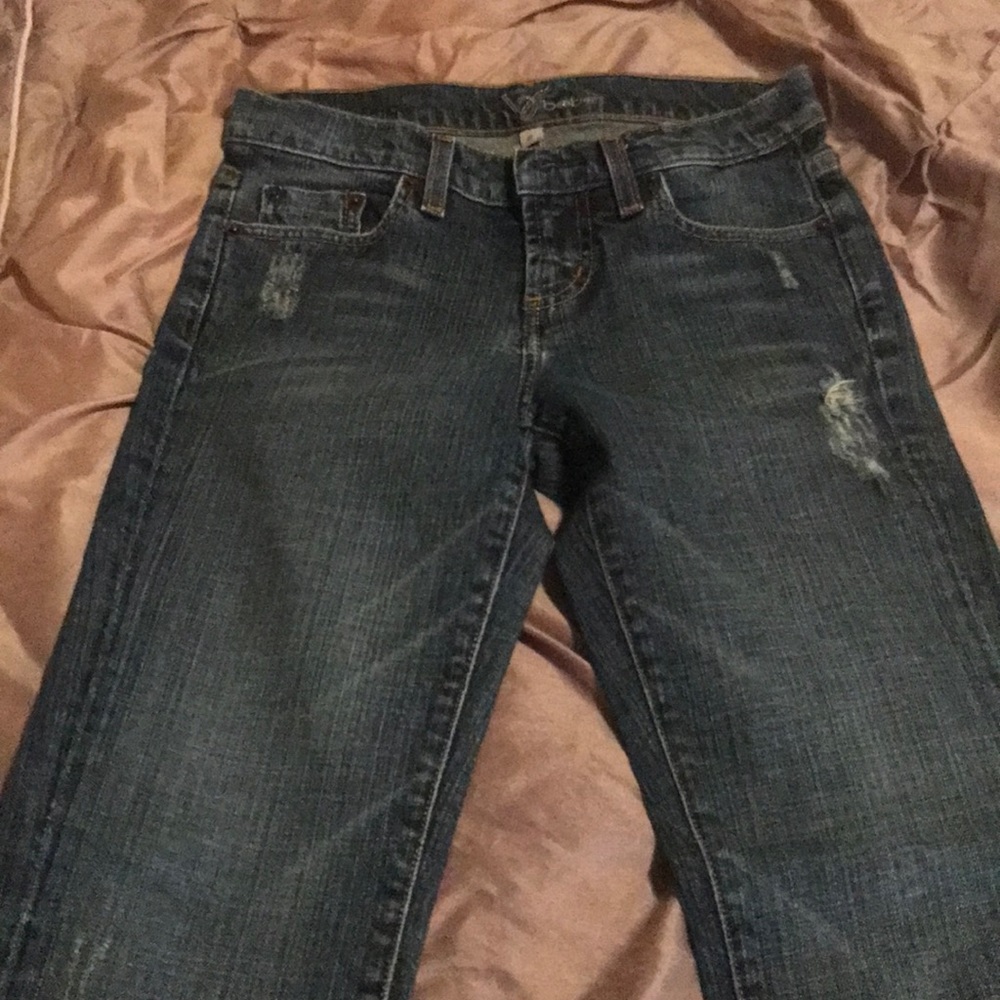BEBE jeans with red “B” on each back pocket.